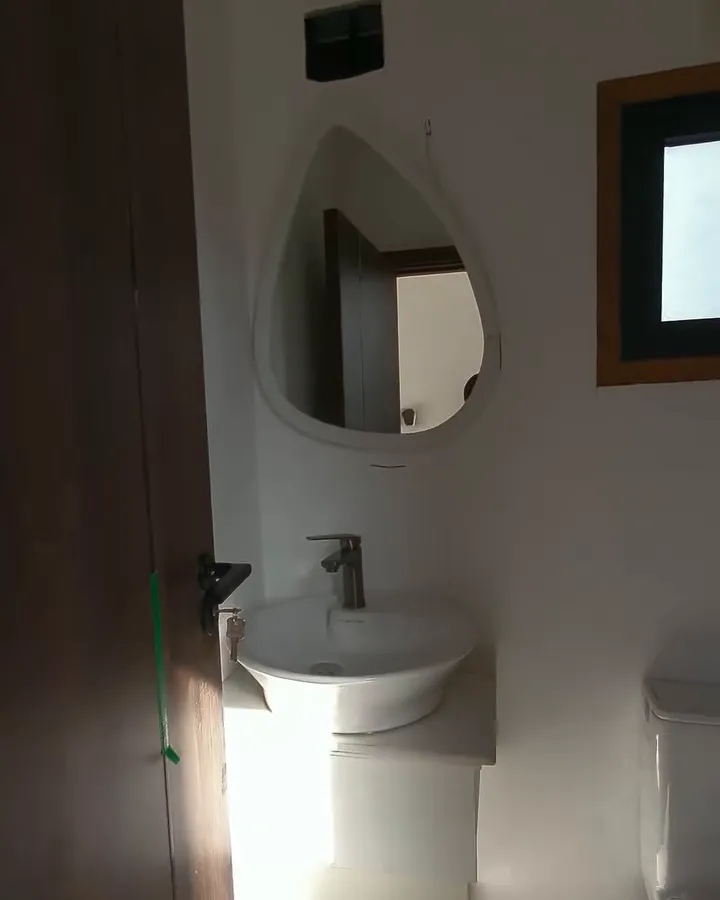 Container conversion bathroom with vessel sink, mirror and window
