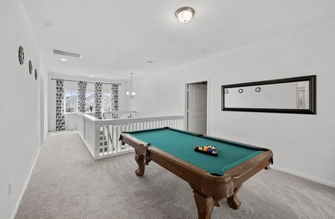 Game room with a full-size pool table