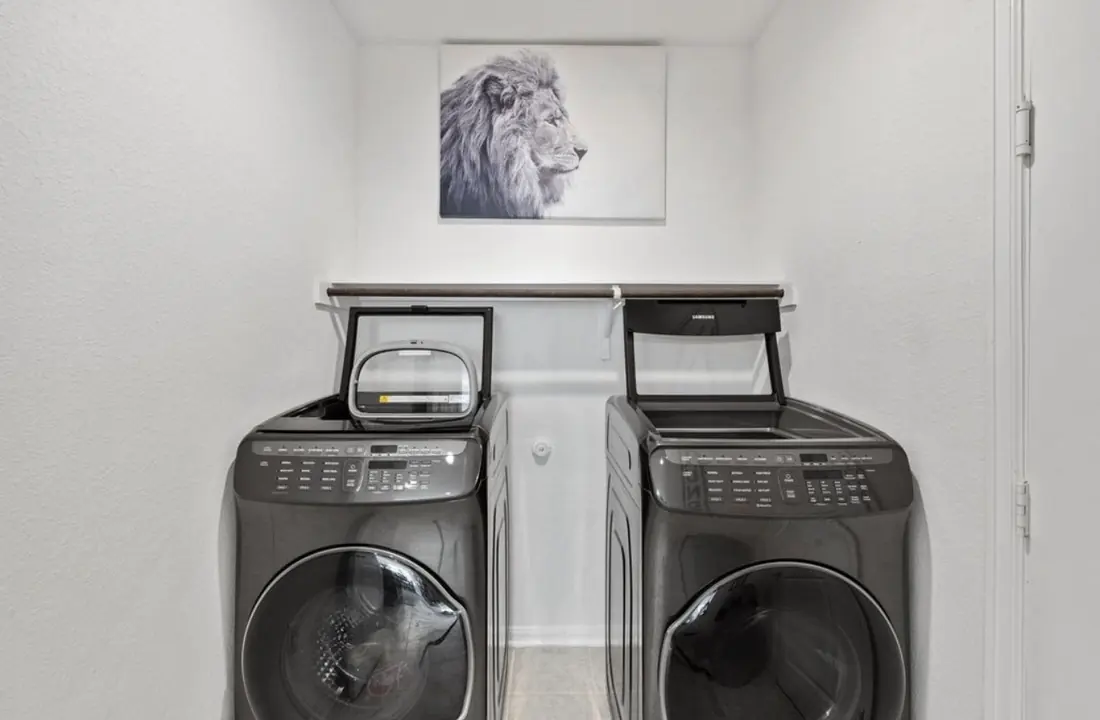 Laundry room with a matching Samsung washer and dryer set