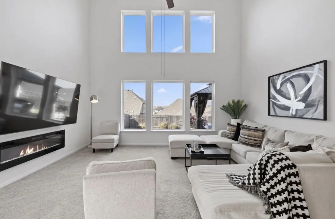 Great room with floor-to-ceiling windows and a fireplace