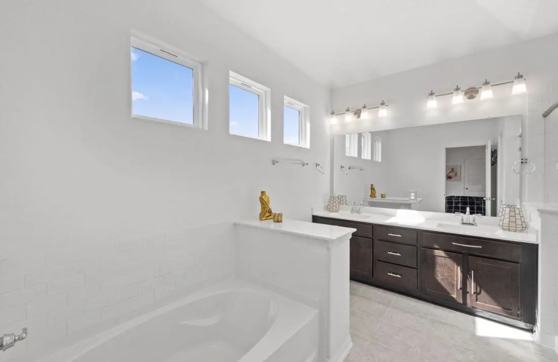 Primary bathroom with a soaking tub and double vanity