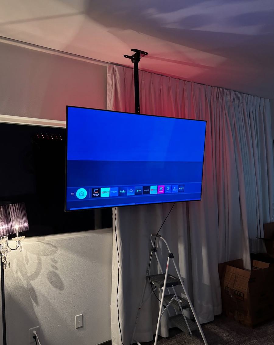 Ceiling-mounted TV bracket angled for the perfect viewing line