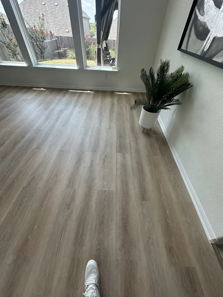 Sunroom with new wood-look vinyl plank floor