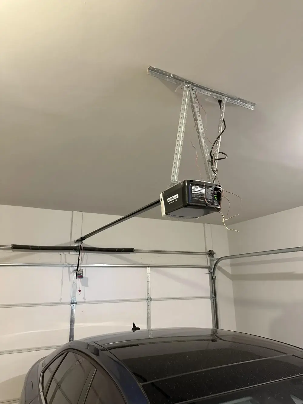 Garage door opener wiring connected during installation before the cover panel goes back on