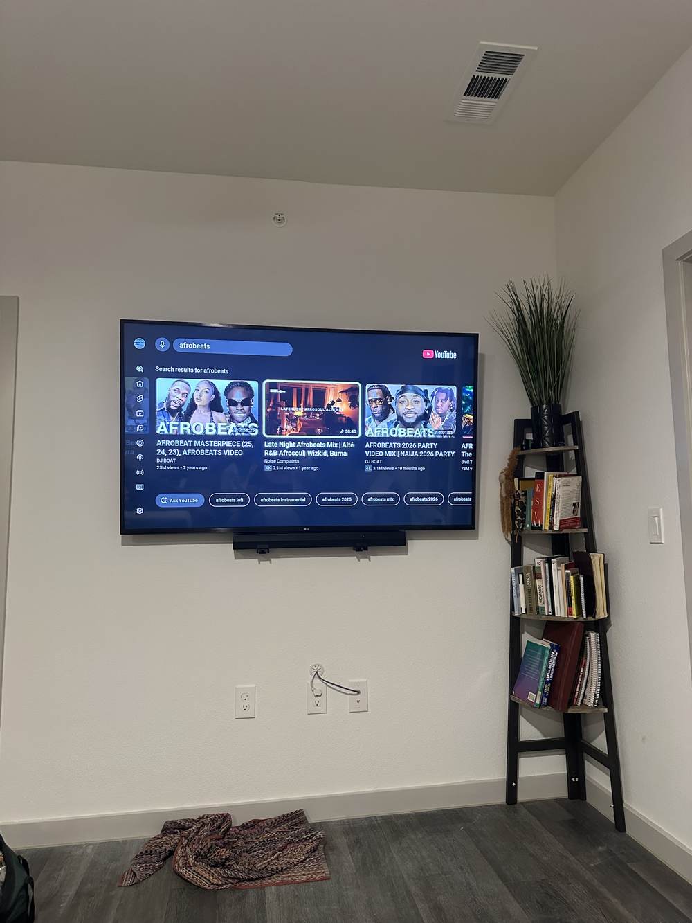 Finished TV mount with soundbar in a South Austin living room